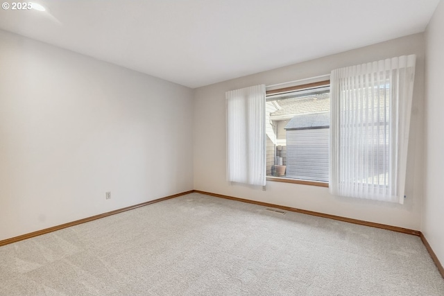 empty room featuring carpet flooring