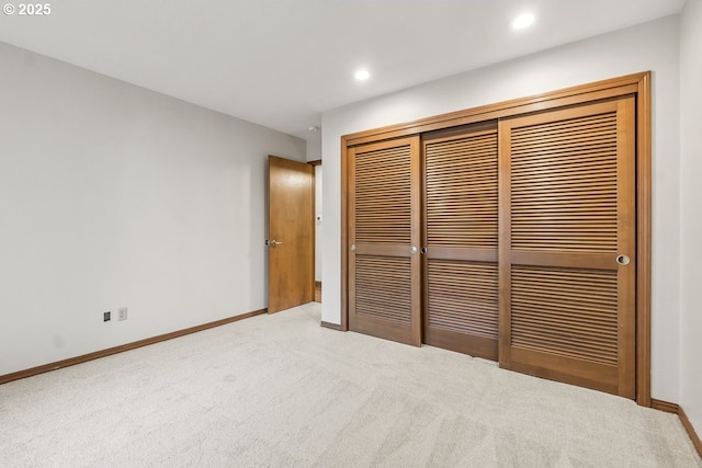 unfurnished bedroom with carpet floors and a closet