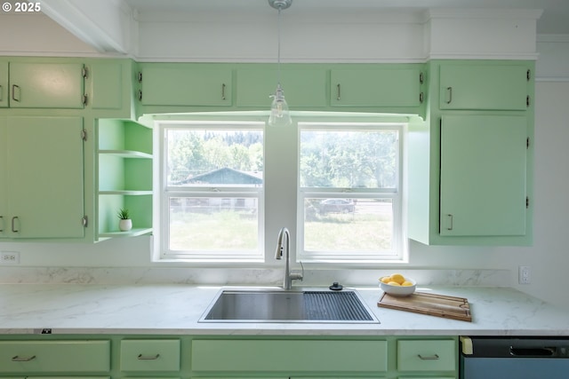 kitchen with a sink, green cabinetry, dishwasher, and open shelves