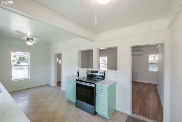 kitchen with stainless steel electric range oven, an AC wall unit, blue cabinetry, light countertops, and light floors