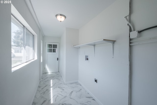 laundry room with washer hookup, light marble finish floors, and baseboards
