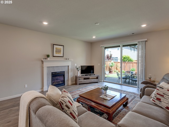472 SW 16th Ave, Canby, OR 97013 - living room featuring wood finished floors, a tile fireplace, and recessed lighting