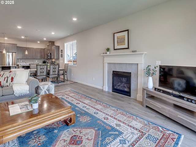 472 SW 16th Ave, Canby, OR 97013 - living room with light wood finished floors, recessed lighting, and a fireplace