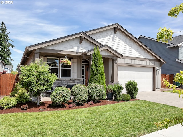 472 SW 16th Ave, Canby, OR 97013 - craftsman house featuring an attached garage, driveway, stone siding, and board and batten siding