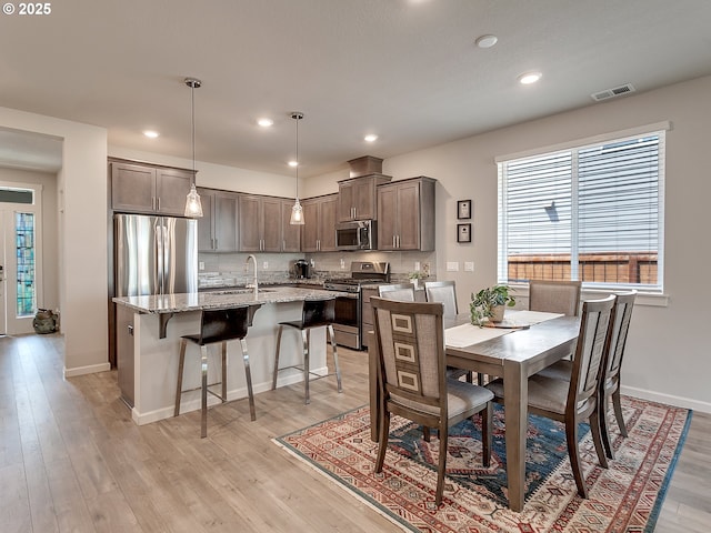 472 SW 16th Ave, Canby, OR 97013 - dining area with healthy amount of natural light, light wood-style flooring, and recessed lighting