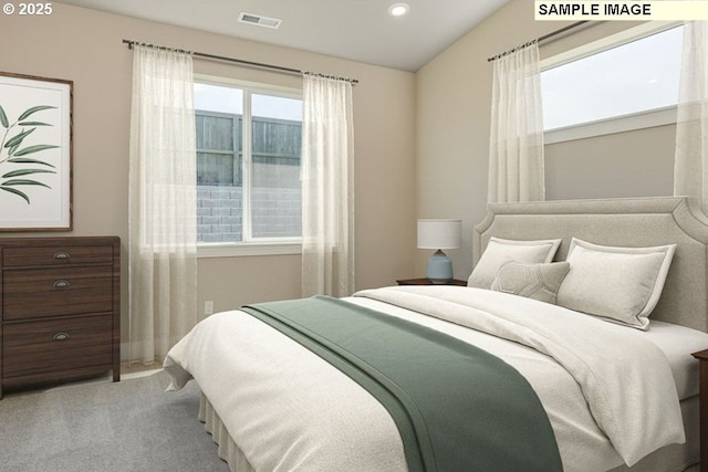 bedroom with visible vents and carpet flooring