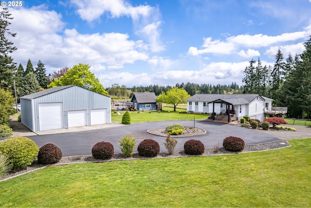 220 Plomondon Rd, Toledo, WA 98591 - view of yard with a garage and an outbuilding