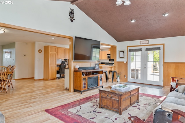 220 Plomondon Rd, Toledo, WA 98591 - living room with french doors, wainscoting, high vaulted ceiling, recessed lighting, and light wood-style flooring
