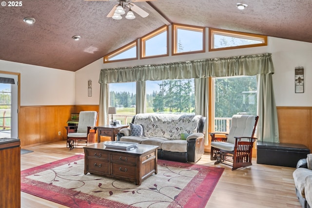 220 Plomondon Rd, Toledo, WA 98591 - living room with a healthy amount of sunlight, a wainscoted wall, and vaulted ceiling