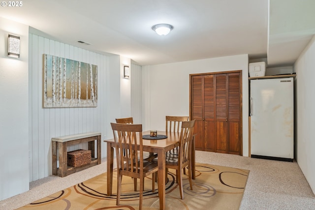 220 Plomondon Rd, Toledo, WA 98591 - carpeted dining space with a fireplace and visible vents