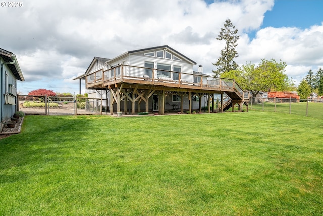 220 Plomondon Rd, Toledo, WA 98591 - back of property with a deck, a fenced backyard, a gate, a lawn, and stairway