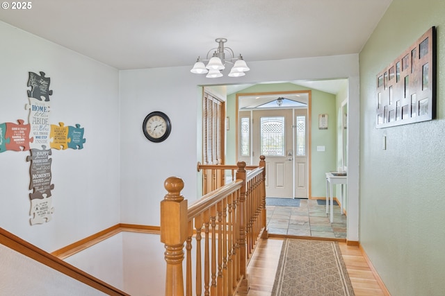 220 Plomondon Rd, Toledo, WA 98591 - foyer featuring baseboards, light wood-style floors, and a chandelier