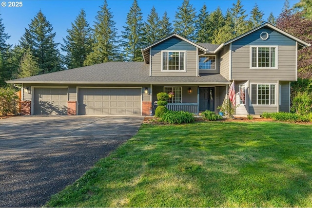 20606 NE 229th St, Battle Ground, WA 98604 - view of front of house with covered porch, a front yard, a garage, brick siding, and aphalt driveway