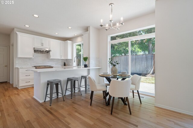 14067 Chatham Ct, Lake Oswego, OR 97035 - dining space featuring healthy amount of natural light, a chandelier, light wood-type flooring, and recessed lighting
