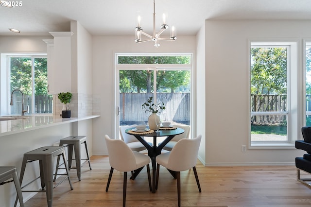 14067 Chatham Ct, Lake Oswego, OR 97035 - dining room featuring a chandelier, plenty of natural light, light wood-style flooring, and recessed lighting