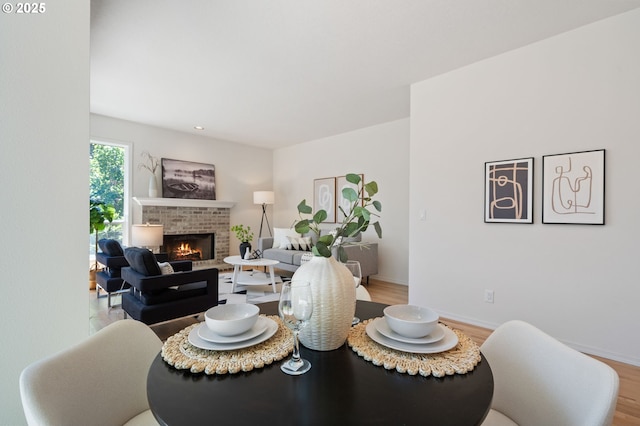 14067 Chatham Ct, Lake Oswego, OR 97035 - dining room with wood finished floors and a fireplace