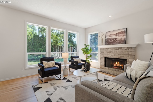 14067 Chatham Ct, Lake Oswego, OR 97035 - living area featuring plenty of natural light, wood finished floors, a fireplace, and recessed lighting