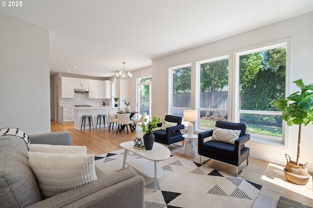 14067 Chatham Ct, Lake Oswego, OR 97035 - living room with a chandelier, light wood-style flooring, and recessed lighting