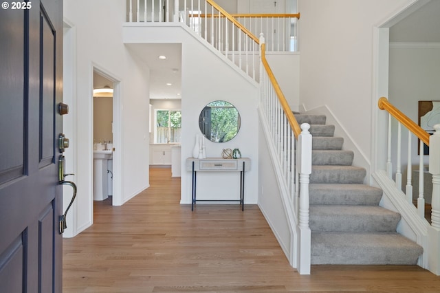 14067 Chatham Ct, Lake Oswego, OR 97035 - foyer entrance featuring light wood-type flooring, stairway, and a towering ceiling