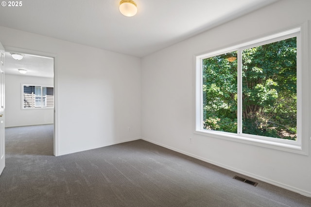 14067 Chatham Ct, Lake Oswego, OR 97035 - empty room featuring dark carpet and baseboards