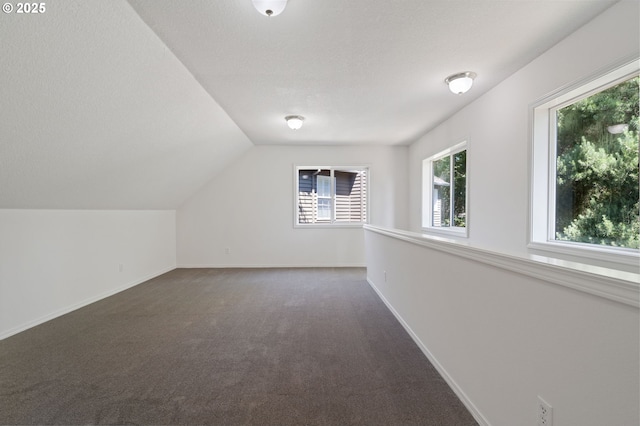 14067 Chatham Ct, Lake Oswego, OR 97035 - additional living space with dark carpet, plenty of natural light, and lofted ceiling