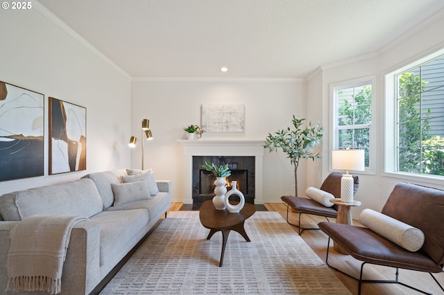 14067 Chatham Ct, Lake Oswego, OR 97035 - living area with a tiled fireplace, ornamental molding, wood finished floors, and recessed lighting