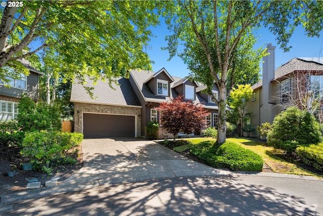14067 Chatham Ct, Lake Oswego, OR 97035 - view of front of property featuring driveway, an attached garage, and stone siding