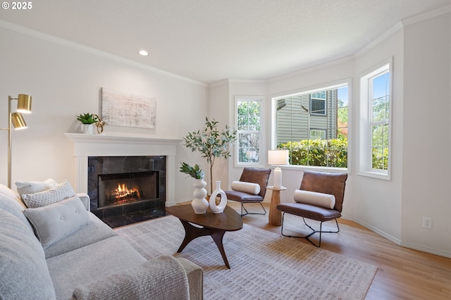 14067 Chatham Ct, Lake Oswego, OR 97035 - living area featuring wood finished floors, crown molding, recessed lighting, and a fireplace