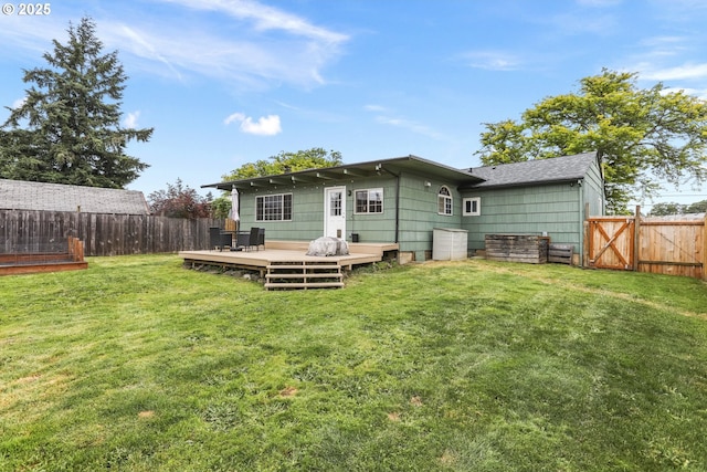 2064 Tualatin St, Saint Helens, OR 97051 - back of house featuring a fenced backyard, a wooden deck, a gate, and a shingled roof