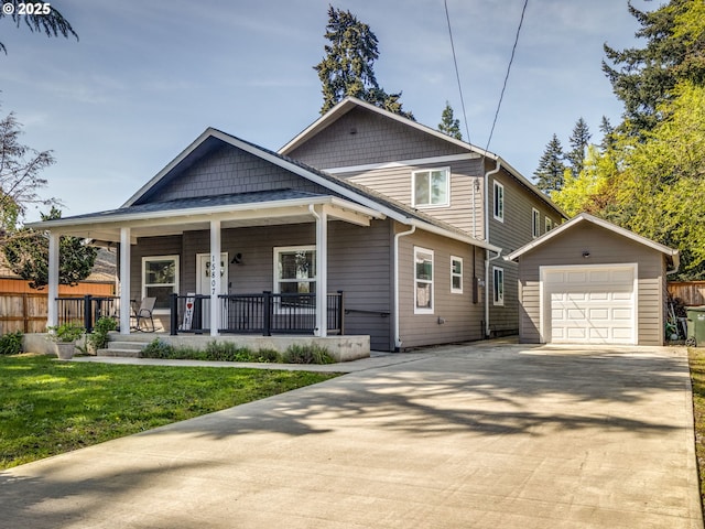 15807 SE Rainier Ave, Clackamas, OR 97015 - view of front of house featuring an outbuilding, a porch, concrete driveway, and a front yard