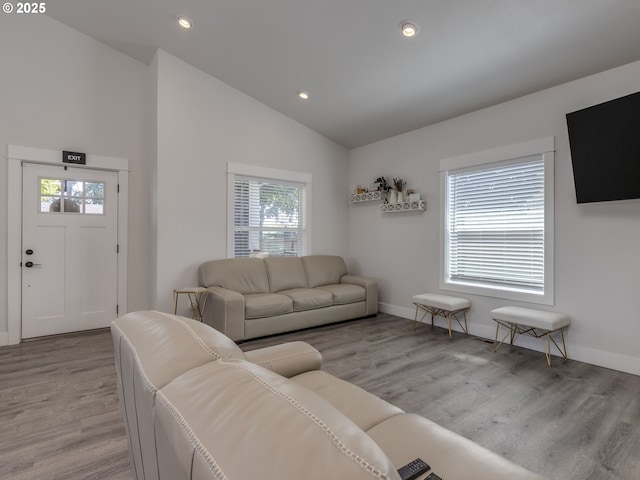 15807 SE Rainier Ave, Clackamas, OR 97015 - living room featuring vaulted ceiling, light wood finished floors, recessed lighting, and baseboards