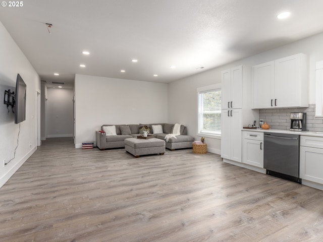 15807 SE Rainier Ave, Clackamas, OR 97015 - living area with recessed lighting, light wood-style floors, and baseboards