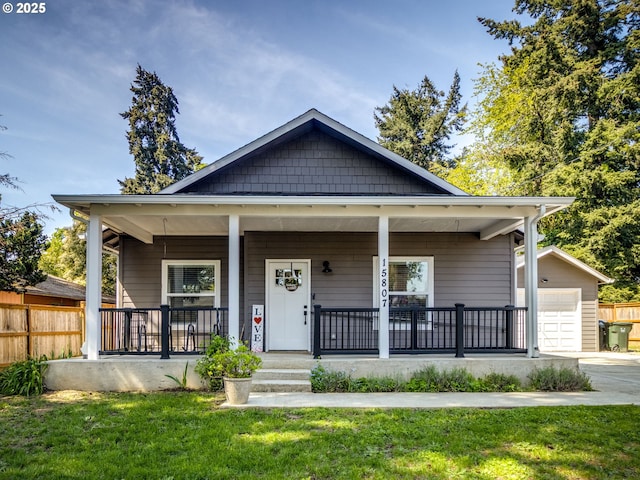 15807 SE Rainier Ave, Clackamas, OR 97015 - bungalow featuring a porch, an outdoor structure, and driveway