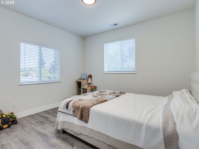 15807 SE Rainier Ave, Clackamas, OR 97015 - bedroom featuring wood finished floors and baseboards
