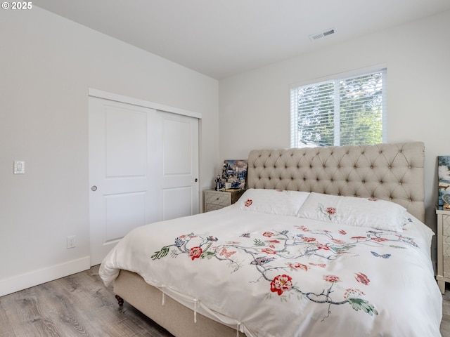 15807 SE Rainier Ave, Clackamas, OR 97015 - bedroom with wood finished floors, a closet, and baseboards