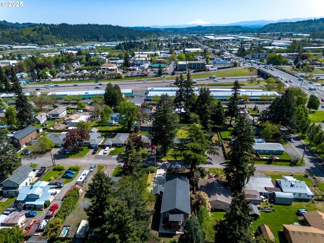 15807 SE Rainier Ave, Clackamas, OR 97015 - aerial overview of property's location featuring a mountain backdrop and nearby suburban area