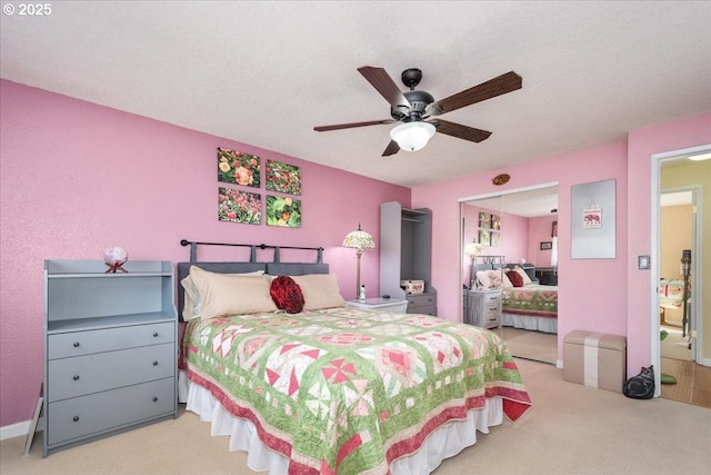 carpeted bedroom featuring ceiling fan