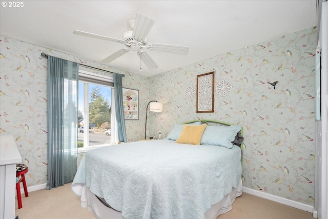 bedroom with light carpet, wallpapered walls, ceiling fan, and baseboards