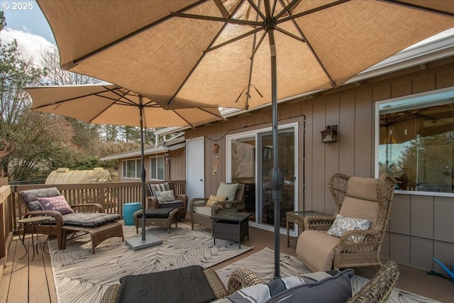 wooden deck with an outdoor hangout area and french doors