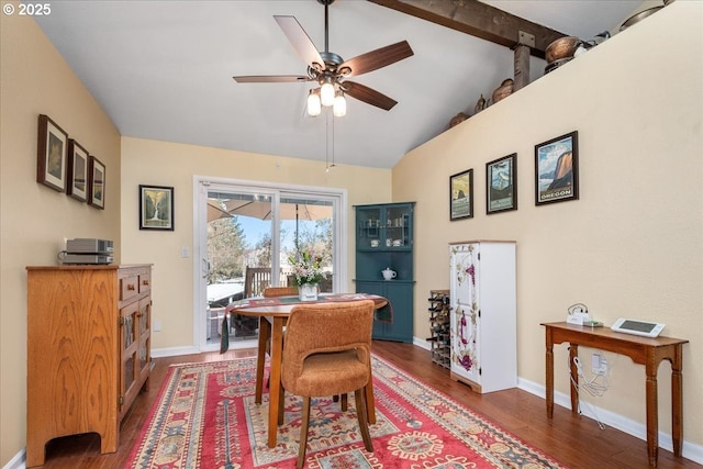 dining space featuring lofted ceiling with beams, ceiling fan, wood finished floors, and baseboards