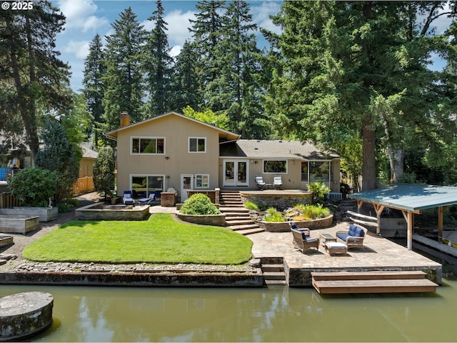 17810 Sarah Hill Ln, Lake Oswego, OR 97035 - rear view of house featuring french doors, a patio area, stairs, a deck with water view, and a chimney