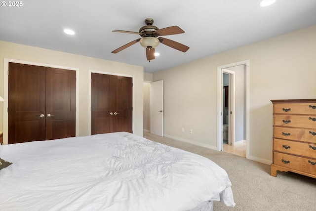 17810 Sarah Hill Ln, Lake Oswego, OR 97035 - bedroom featuring two closets, recessed lighting, light colored carpet, and a ceiling fan