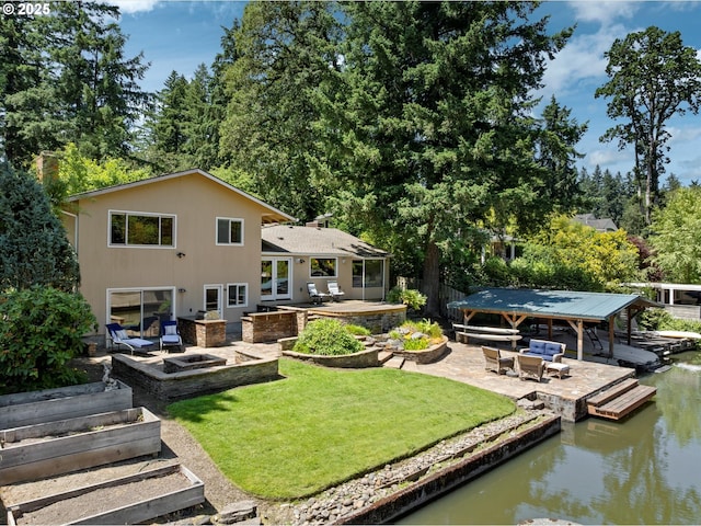 17810 Sarah Hill Ln, Lake Oswego, OR 97035 - dock featuring a patio area, a water view, a lawn, and view of scattered trees