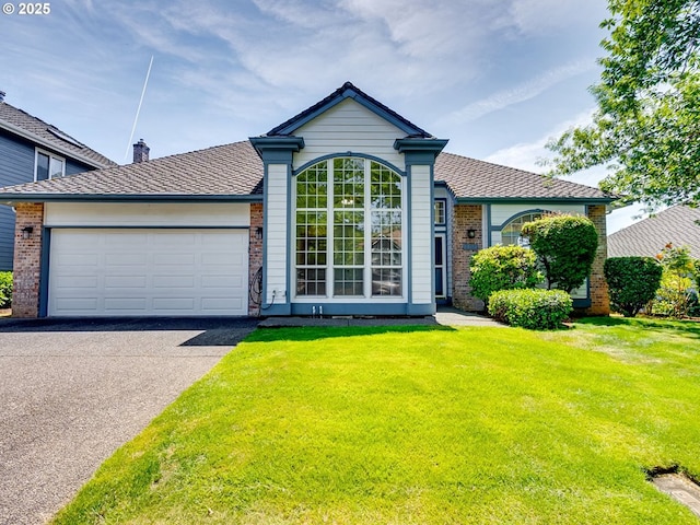 13811 SE 36th St, Vancouver, WA 98683 - view of front of house with asphalt driveway, an attached garage, a front lawn, and brick siding