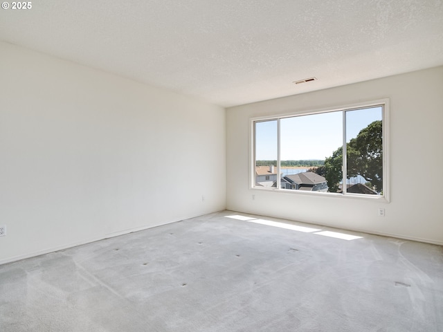 13811 SE 36th St, Vancouver, WA 98683 - spare room with carpet floors, a textured ceiling, and baseboards