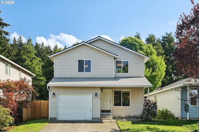 view of front of property featuring fence, an attached garage, driveway, and a front yard