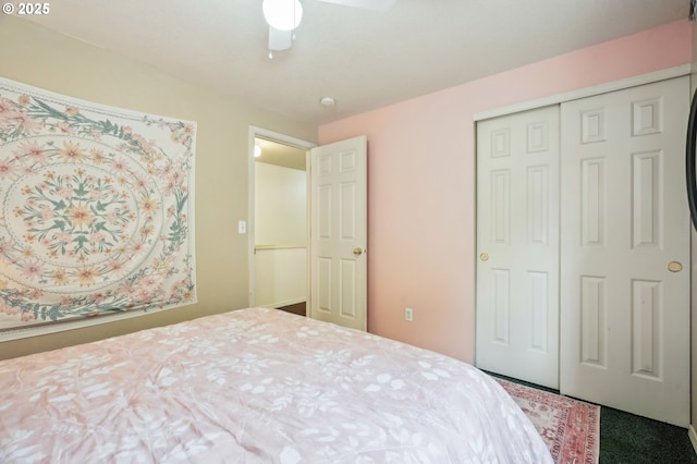 bedroom featuring a ceiling fan, carpet, and a closet