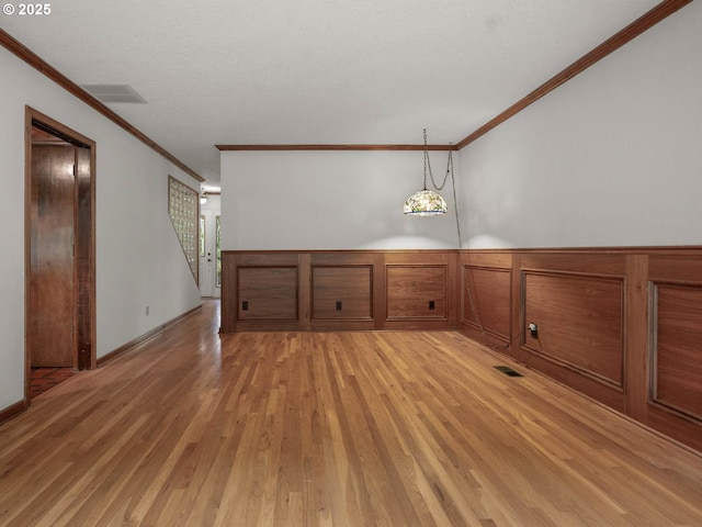 18036 NW Emmaus Ln, Portland, OR 97231 - additional living space with light wood-style flooring and wainscoting
