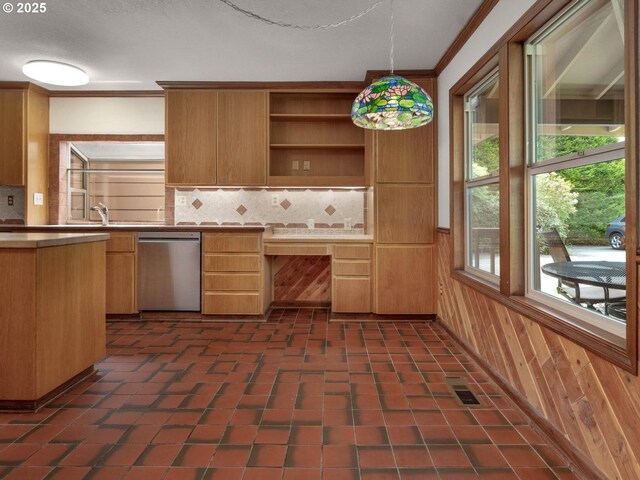 18036 NW Emmaus Ln, Portland, OR 97231 - kitchen with dishwasher, tasteful backsplash, ornamental molding, hanging light fixtures, and light countertops