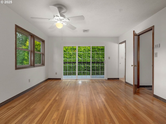 18036 NW Emmaus Ln, Portland, OR 97231 - empty room with light wood finished floors, baseboards, and a ceiling fan